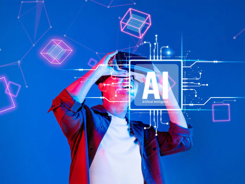 Graphic depicting a person in virtual reality with the letters "AI" overlaid.