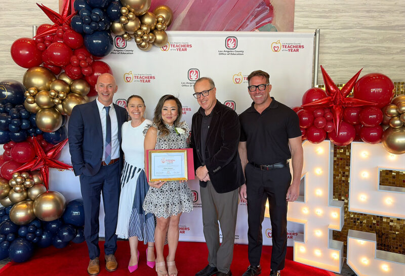 Kwon (center) was honored by LACOE.