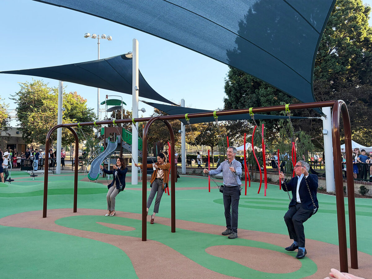 Mayor Craig Corman and members of the City Council tried out the new equipment at La Cienega playground.