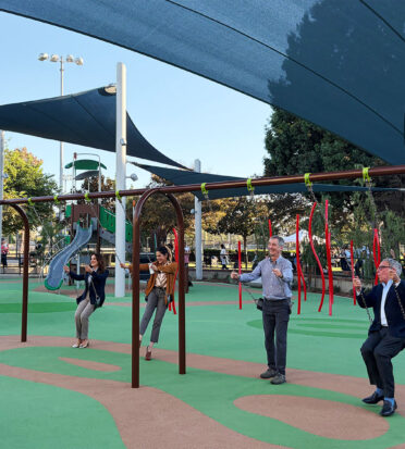 Mayor Craig Corman and members of the City Council tried out the new equipment at La Cienega playground.